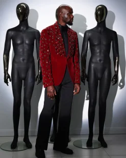 A Mahogany red shawl lapel tuxedo with black and octagonal laser-cut matching Swarovski stones suit
