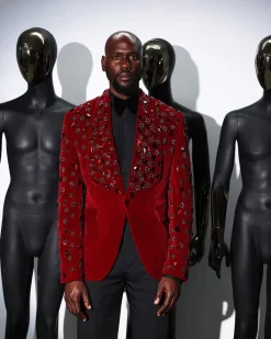 A Mahogany red shawl lapel tuxedo with black and octagonal laser-cut matching Swarovski stones suit
