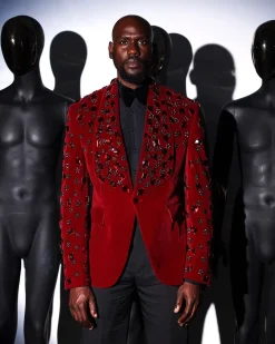 A Mahogany red shawl lapel tuxedo with black and octagonal laser-cut matching Swarovski stones suit