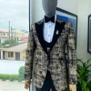 A “Mandarin” Dispersed Black and Gold Peak Lapel Suit