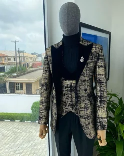A “Mandarin” Dispersed Black And Gold Peak Lapel Suit.