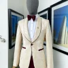 A “Mandarin” dispersed gold ruffle pattern burgundy shawl lapel jacquard suit