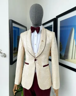 A “Mandarin” dispersed gold ruffle pattern burgundy shawl lapel jacquard suit