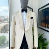 A “Mandarin” dispersed gold abd ivory ruffle pattern shawl lapel jacquard suit