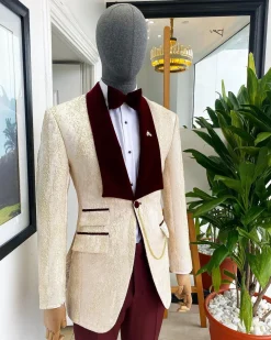 A “Mandarin” dispersed gold ruffle pattern burgundy shawl lapel jacquard suit
