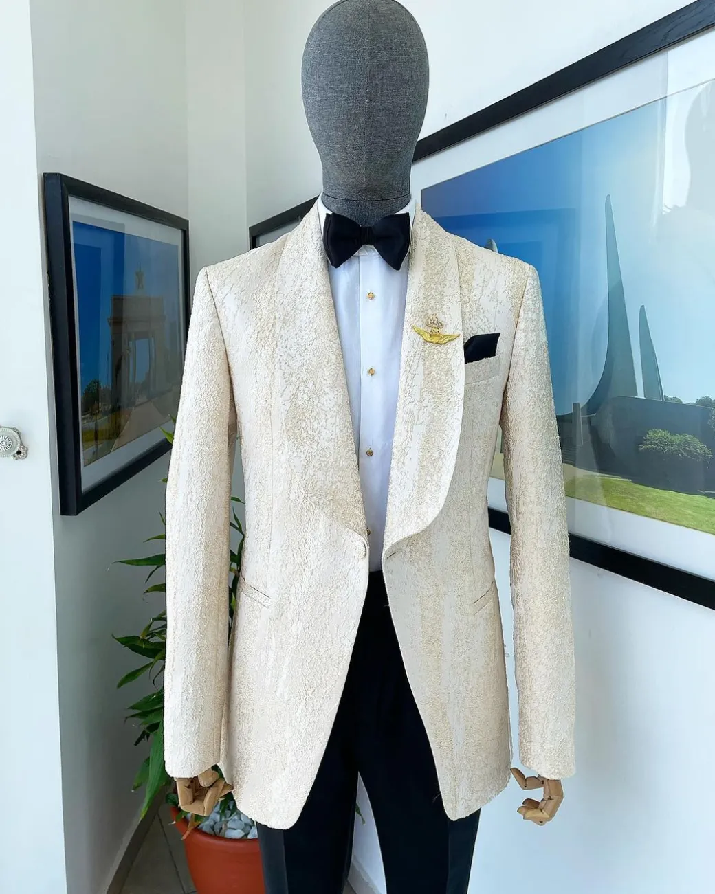 A “Mandarin” dispersed gold abd ivory ruffle pattern shawl lapel jacquard suit