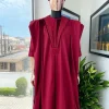 A Maroon red, vehicular lapelled with closed line flap and marching velvet mix embroidery design agbada