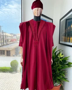 A Maroon red, vehicular lapelled with closed line flap and marching velvet mix embroidery design agbada