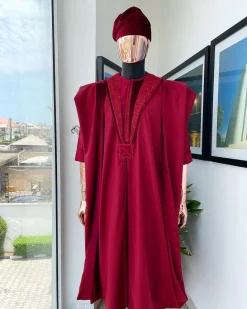 A Maroon red, vehicular lapelled with closed line flap and marching velvet mix embroidery design agbada
