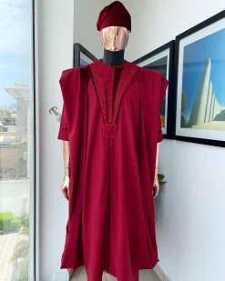 A Maroon red, vehicular lapelled with closed line flap and marching velvet mix embroidery design agbada