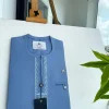 A Maya blue rail line flap with a combat pocket Swarovski button details African traditional senator Kaftan.