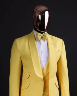 A Middle yellow linen shawl lapel jacket, cross cut unbalanced wrapped waistcoat, bow tie & Gurkha pant Trouser