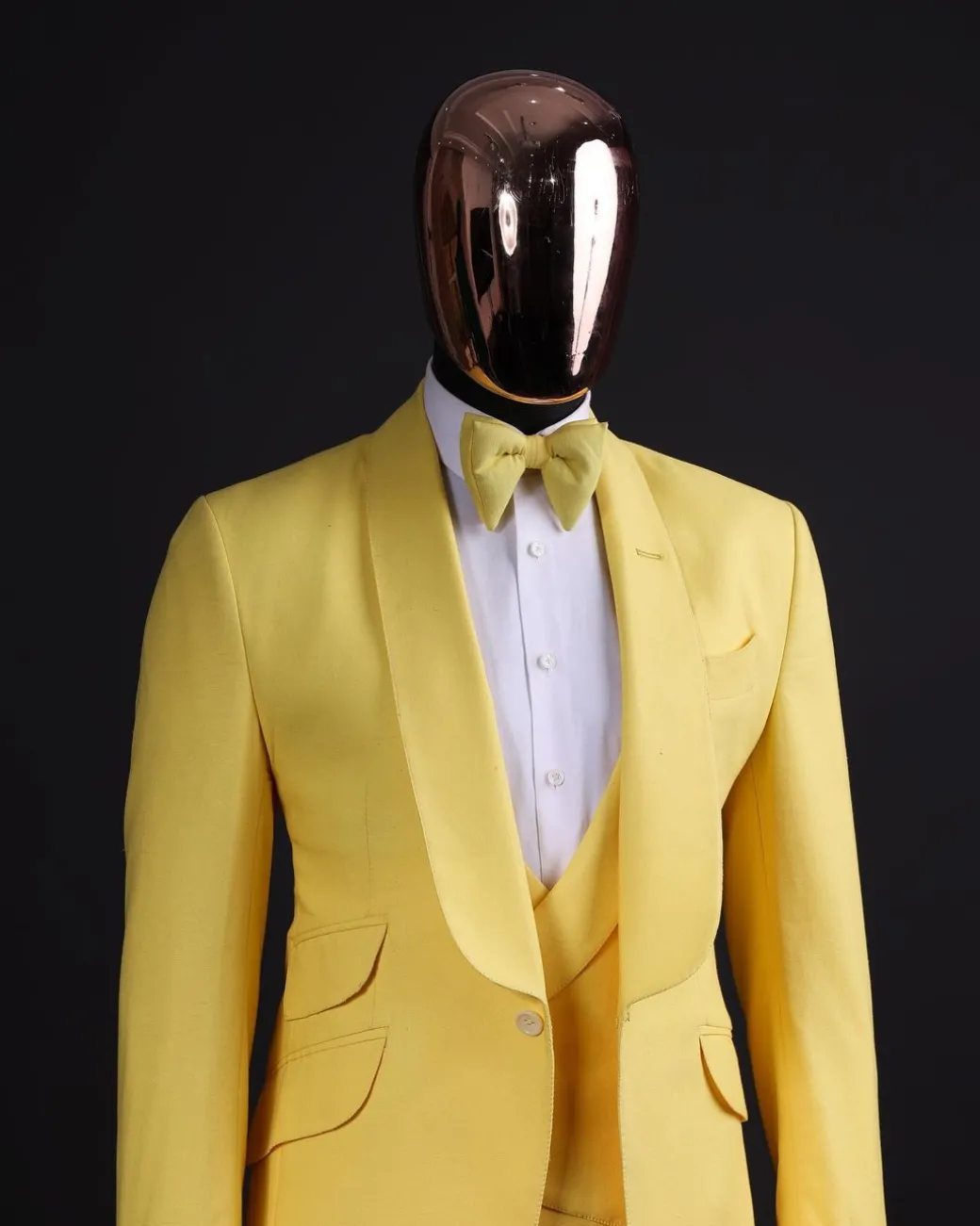 A Middle yellow linen shawl lapel jacket, cross cut unbalanced wrapped waistcoat, bow tie & Gurkha pant Trouser