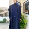 A Midnight Blue Agbada with a maze line Japanese intersection design, senator kaftan with Swarovski button details and sokoto