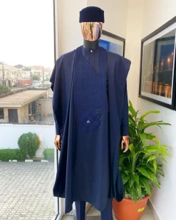 A Midnight Blue Agbada with a maze line Japanese intersection design, senator kaftan with Swarovski button details and sokoto