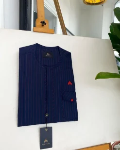 A Midnight Blue and Tomato red Pencil stripe, clear view red Swarovski buttons, front flap, patch pocket details African traditional senator kaftan native.