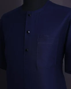 A Midnight blue, broken square pattern, Jorgecarli, front flap with black Swarovski button, 3/4 sleeve African senator Kaftan native.