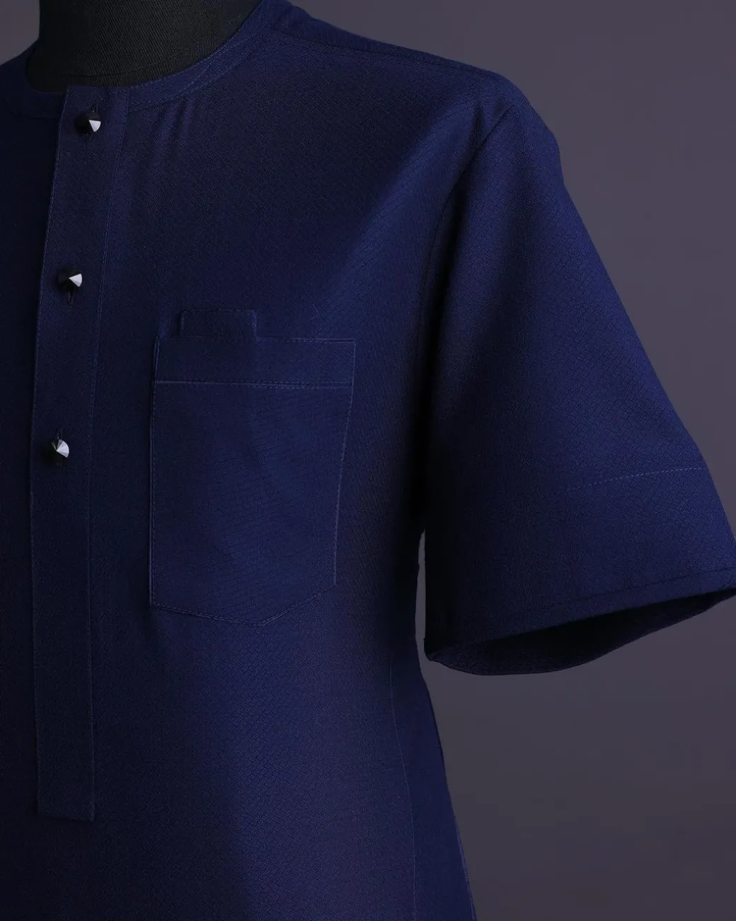 A Midnight blue, broken square pattern, Jorgecarli, front flap with black Swarovski button, 3/4 sleeve African senator Kaftan native.