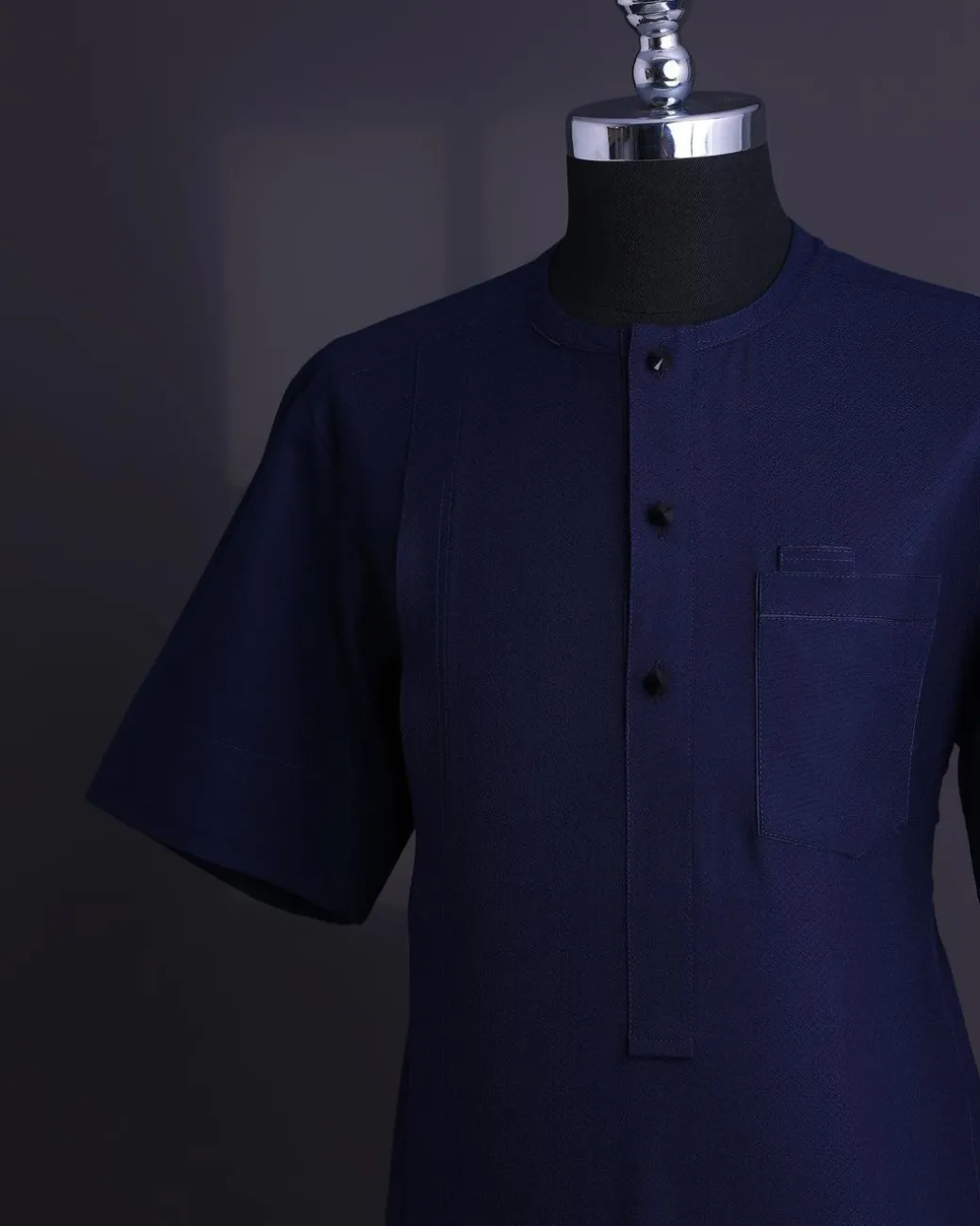 A Midnight blue, broken square pattern, Jorgecarli, front flap with black Swarovski button, 3/4 sleeve African senator Kaftan native.