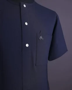 A Midnight blue, brown Aaron wool, front flap with silver Swarovski button, shorts sleeve African senator kaftan native.