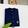 A Midnight Blue, clear view silver Swarovski buttons, gold bee adornment green pocket details African traditional senator kaftan native.
