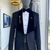 A midnight blue floral pattern jacquard wide-cut shawl lapel tuxedo suit
