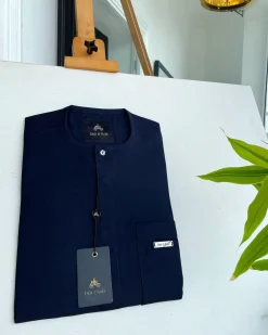 A midnight blue front flap with a clear view Swarovski button detail African traditional senator Kaftan native