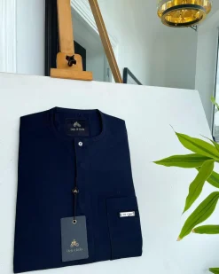 A midnight blue front flap with a clear view Swarovski button detail African traditional senator Kaftan native