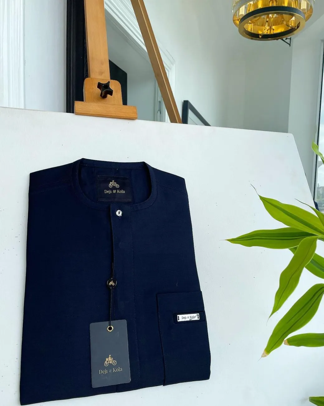 A midnight blue front flap with a clear view Swarovski button detail African traditional senator Kaftan native