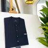 A midnight blue, light blue pencil stripe, clear view Swarovski buttons, horizontal line square embroidery details African traditional senator kaftan native.