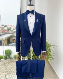 A midnight blue peak lapel floral jacquard tuxedo suit