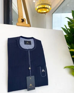 A midnight blue pencil stripe African traditional senator kaftan native.