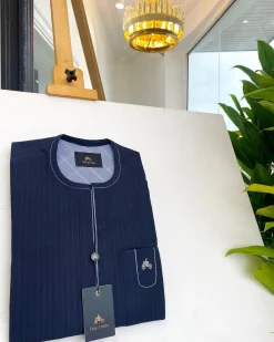 A midnight blue pencil stripe African traditional senator kaftan native.