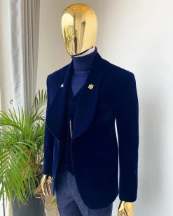 A midnight blue shawl lapel soaked velvet tuxedo suit