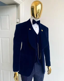 A midnight blue shawl lapel soaked velvet tuxedo suit