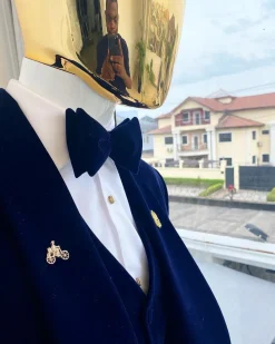 A midnight blue shawl lapel soaked velvet tuxedo suit
