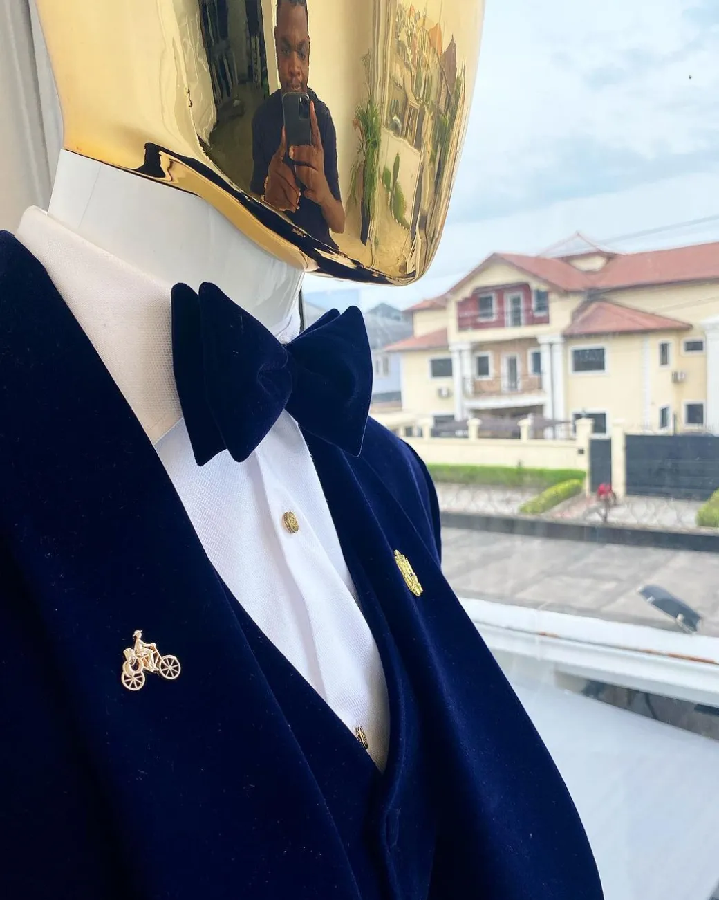 A midnight blue shawl lapel soaked velvet tuxedo suit