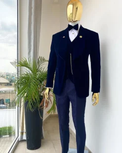 A midnight blue shawl lapel soaked velvet tuxedo suit
