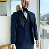 A Midnight Blue with black shawl lapel tuxedo suit