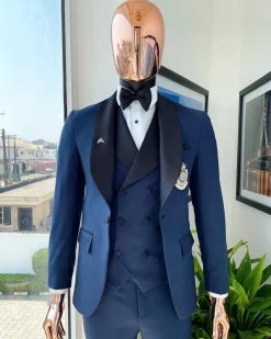 A Midnight Blue with black shawl lapel tuxedo suit