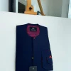 A Midnight blue with paisley detailing, front flap, and a layered patch pocket with a matching Swarovski button African traditional kaftan native