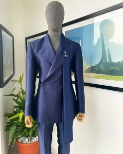 A Mikado Silk “rumble in jungle”, wrap Notch lapel, slant sache blazer suit.