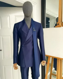A Mikado Silk “rumble in jungle”, wrap Notch lapel, slant sache blazer suit.