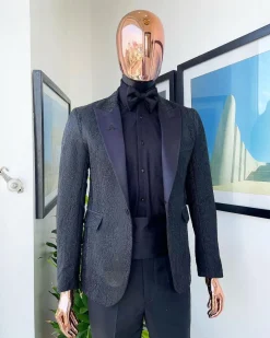 A monochrome charcoal black, peak lapel, metallic Jacquard tuxedo suit.