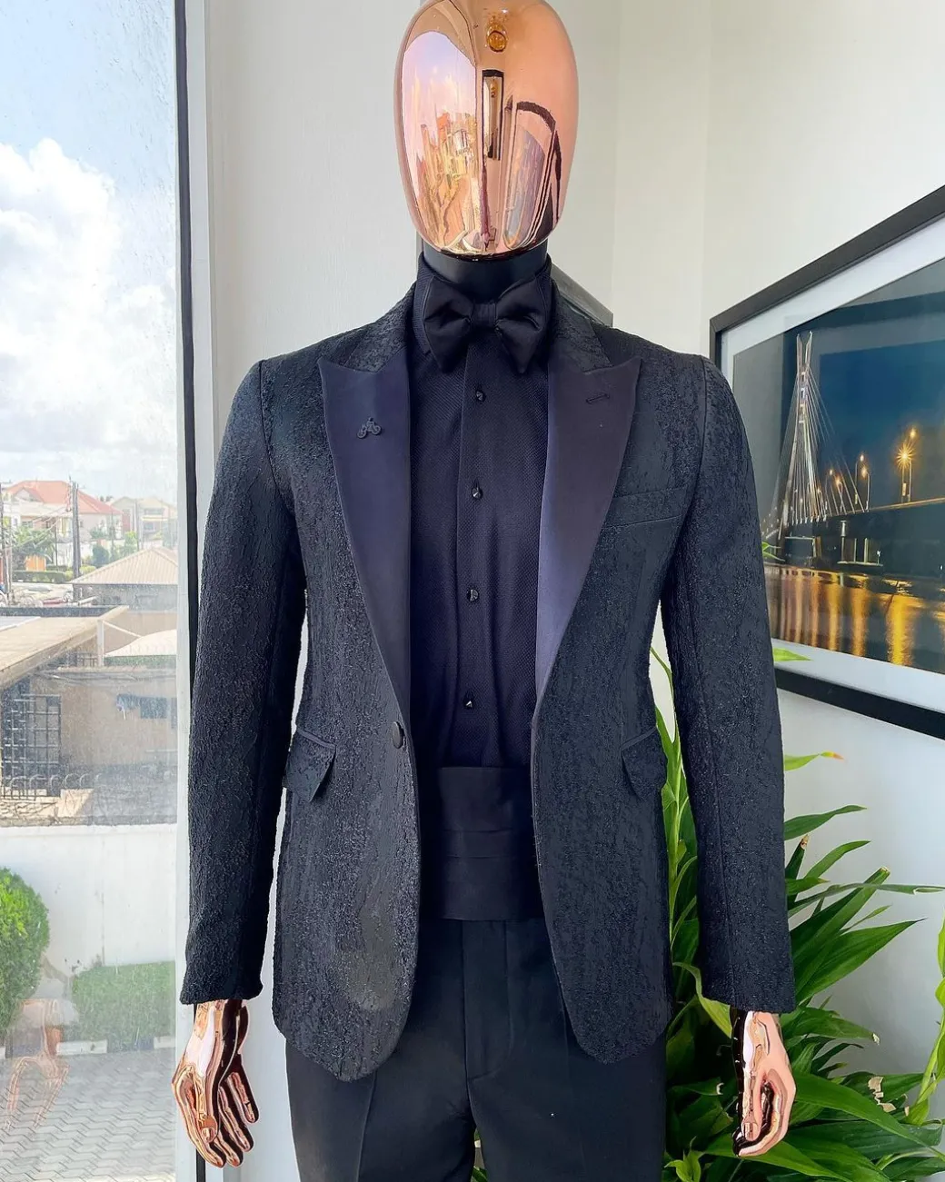 A monochrome charcoal black, peak lapel, metallic Jacquard tuxedo suit.