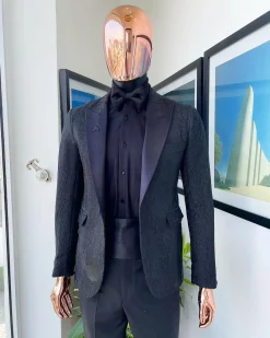 A monochrome charcoal black, peak lapel, metallic Jacquard tuxedo suit.