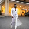 A monochrome, peak lapel, light multi-color dyed trench double breasted jacquard with bunny button details suit