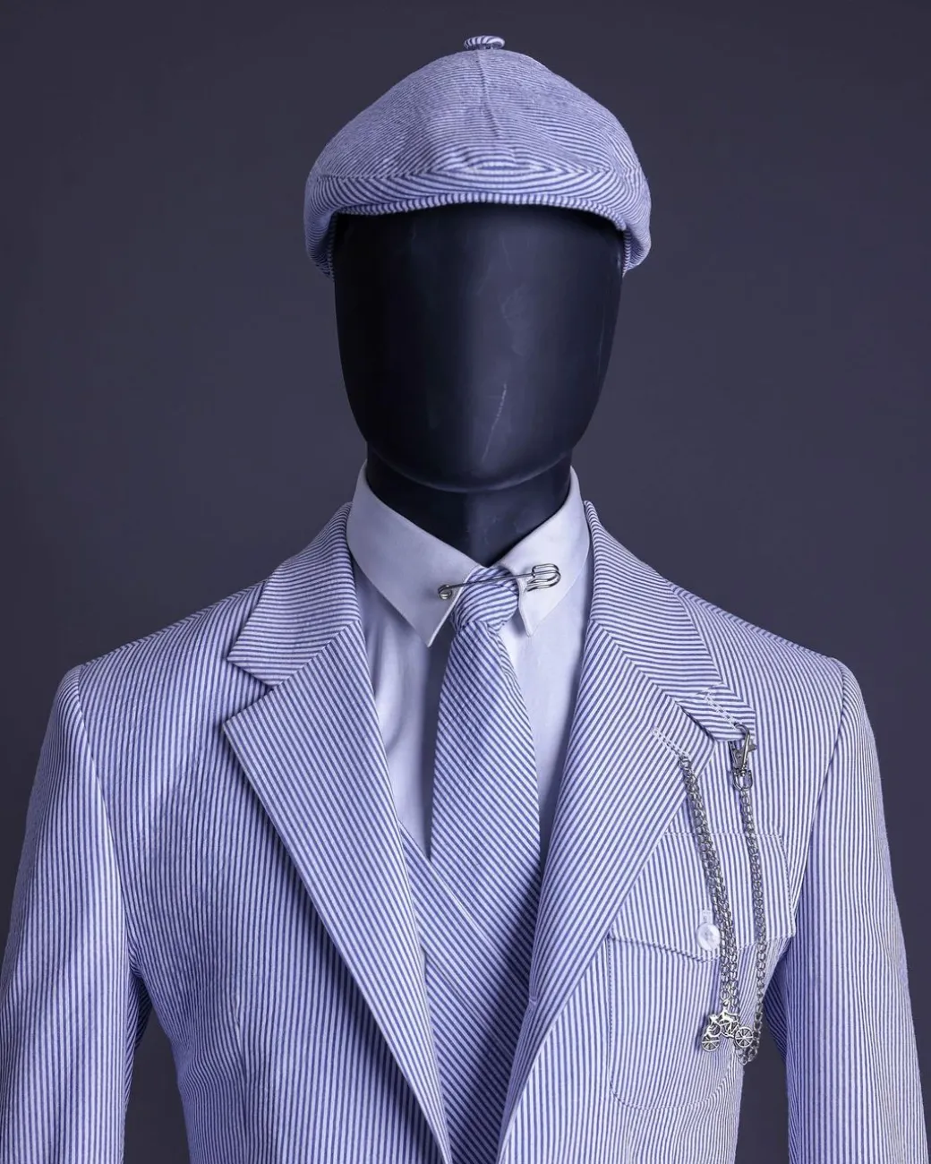 A monochrome seersucker (rail road stripe) notch lapel suit