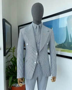 A monochrome seersucker (rail road stripe) notch lapel suit
