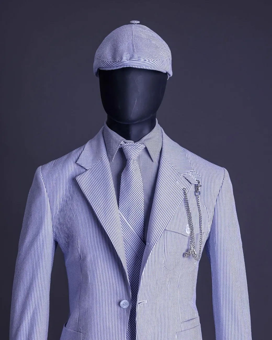 A monochrome seersucker (rail road stripe) notch lapel suit